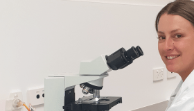 scientist with microscope 