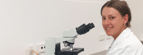 scientist with microscope